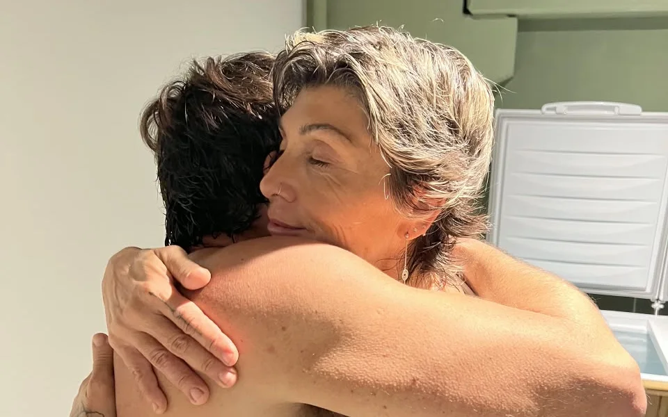 Radha offering a warm embrace during a moment of connection