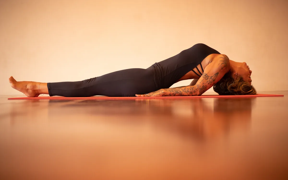 Radha practising a heart-opening yoga posture